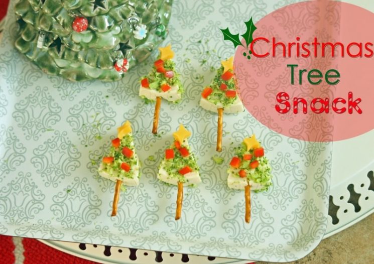 Triangle shaped tree topped with veggie ornaments on a holiday plate